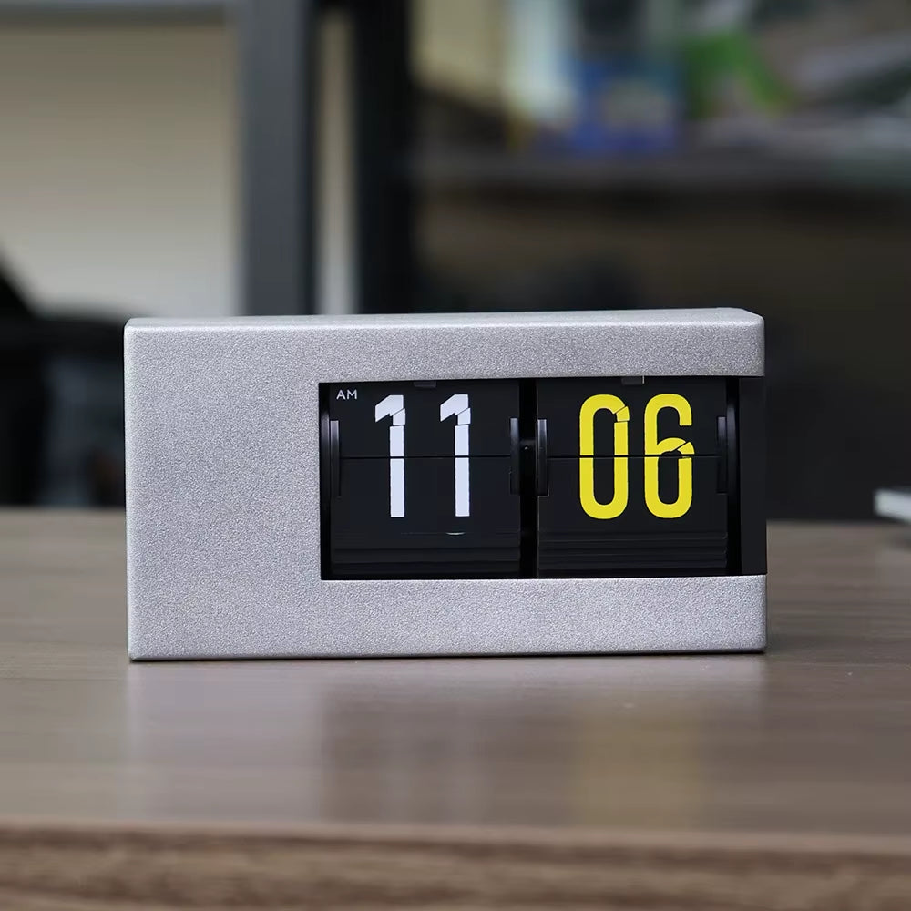 Automatic metal flip clock on a minimalist desk